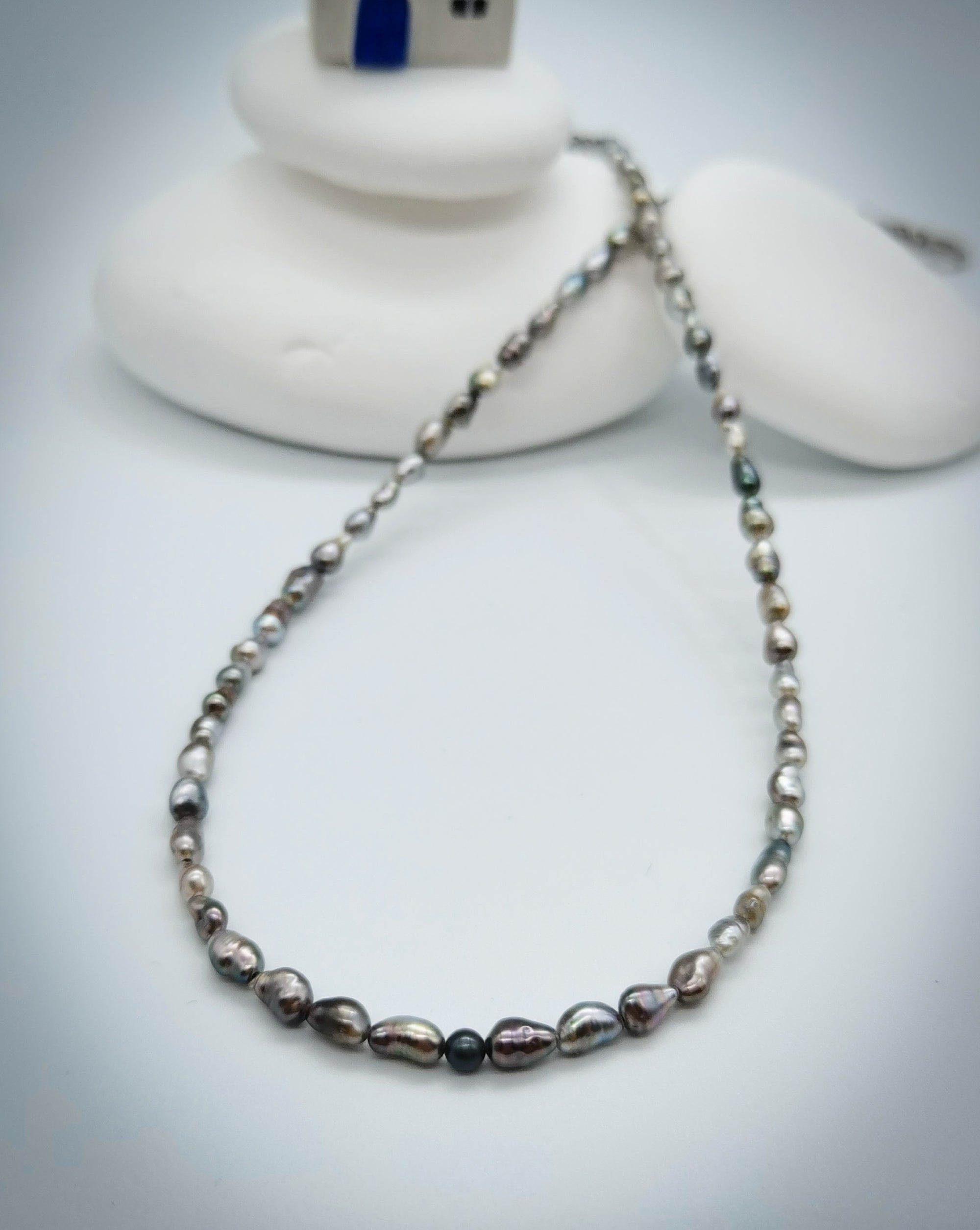 CLOSE UP VIEW OF SECOND PAIRNING NECKLACE OPTION FOR BAROQUE SUNBURST PENDANT, lay flat on white background