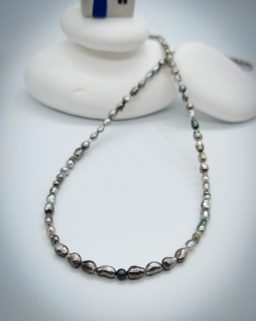 CLOSE UP VIEW OF SECOND PAIRNING NECKLACE OPTION FOR BAROQUE SUNBURST PENDANT, lay flat on white background 