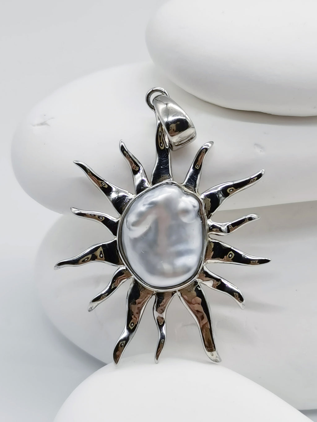 Another CLOSE UP VIEW OF BAROQUE SUNBURST PENDANT ALONE against white background, from a slight different angle to show the subtle blue overtone of the pearl 