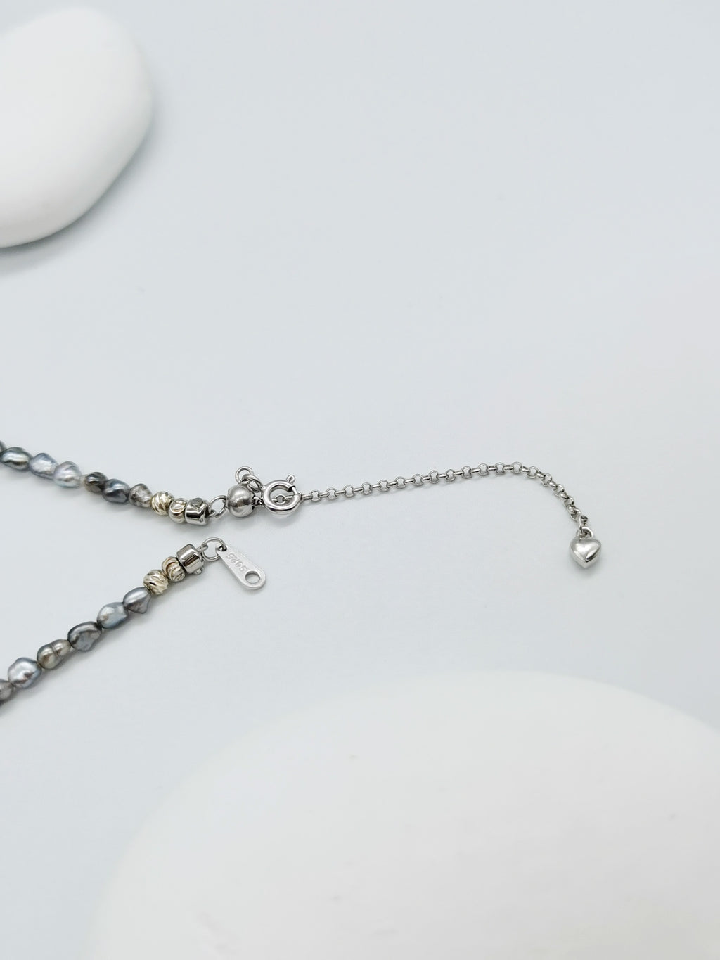 CLASP DETAIL OF HEART PEARL NECKLACE WITH GOLD BEADS, showing sterling silver hallmark 