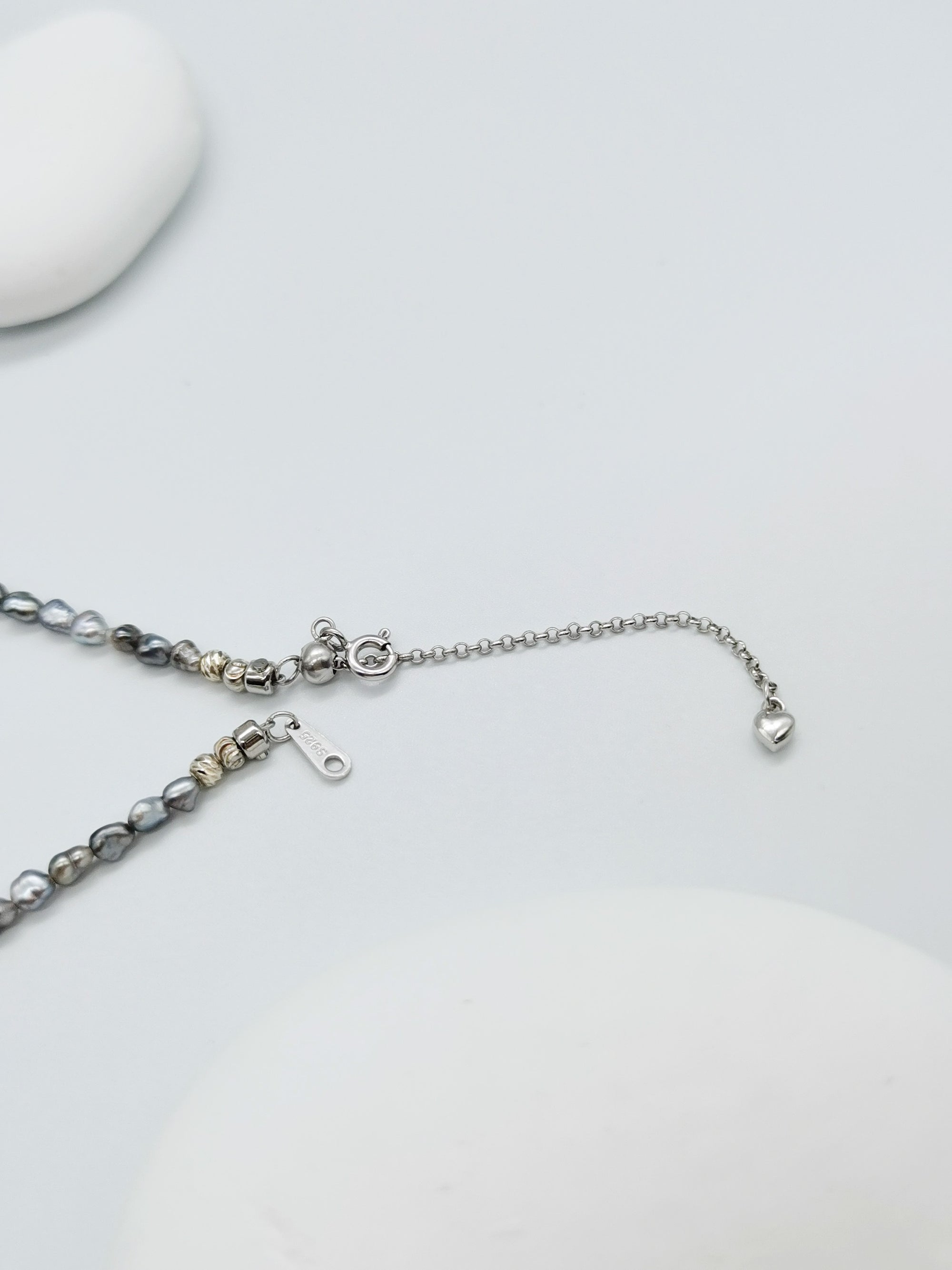 CLASP DETAIL OF HEART PEARL NECKLACE WITH GOLD BEADS, showing sterling silver hallmark 