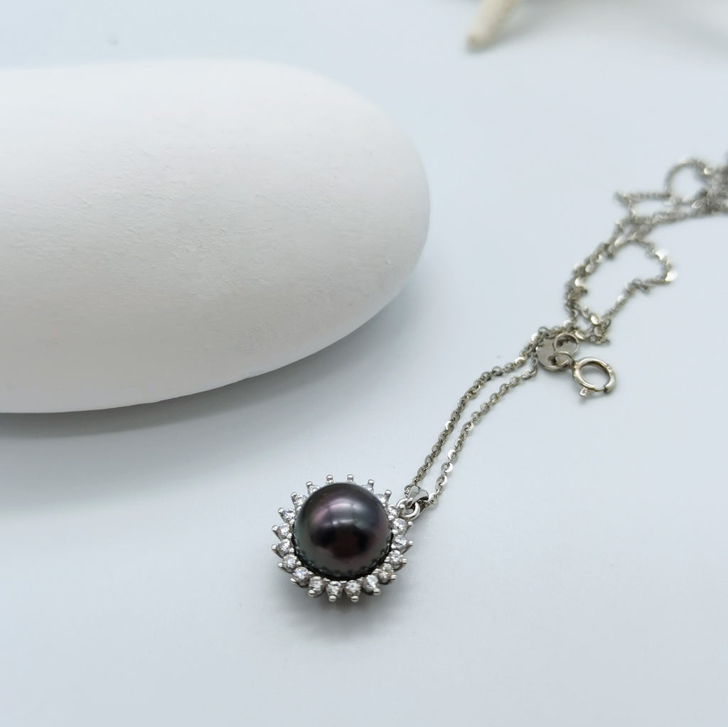 Tahitian pearl pendant necklace showing CZ halo setting 925 sterling silver chain sunburst mount openwork back design