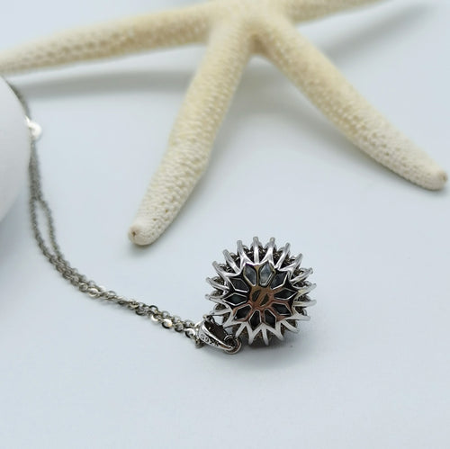 Tahitian pearl pendant necklace back view showing intricate sunburst openwork design 925 sterling silver mount starfish styling