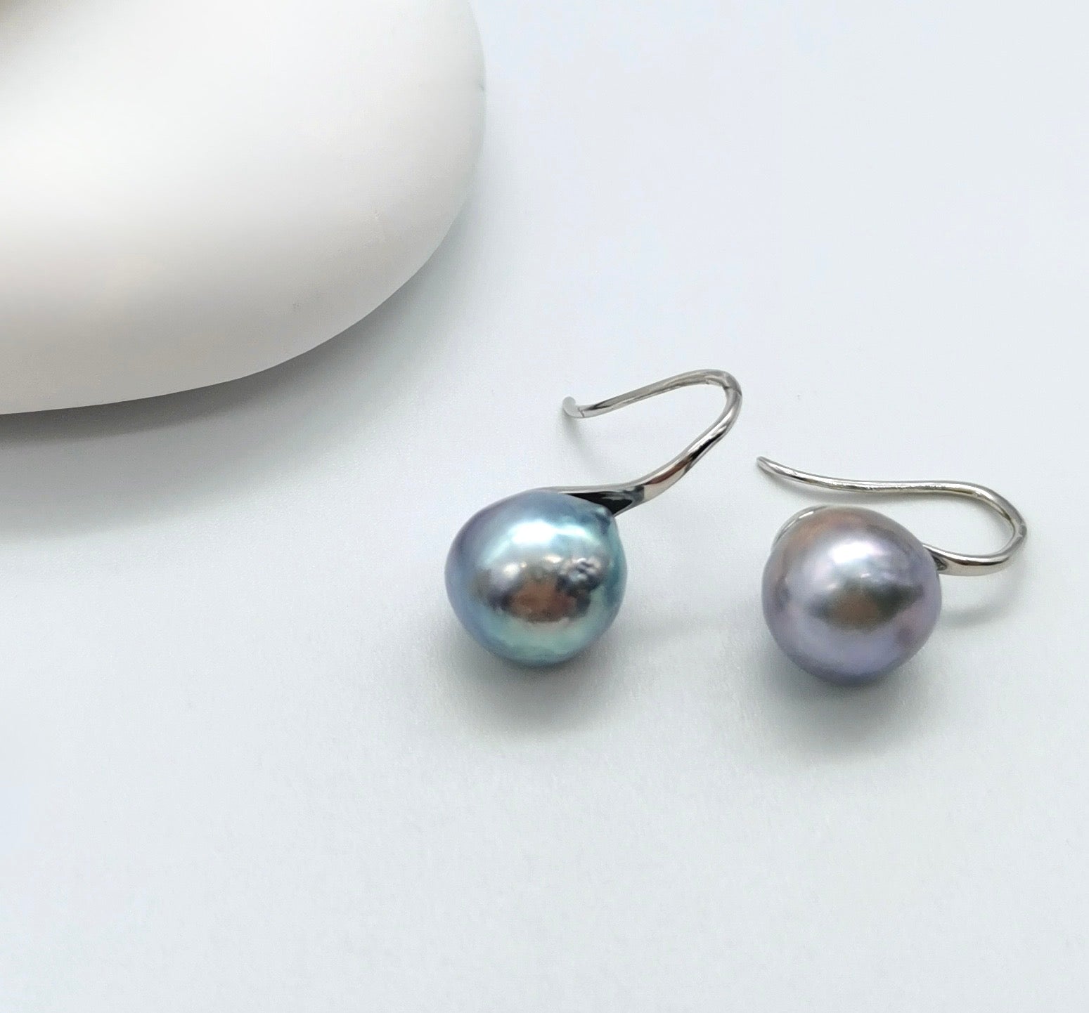 Detailed view of natural blue rose Akoya baroque pearl earrings showing organic pearl shapes and premium lustre quality