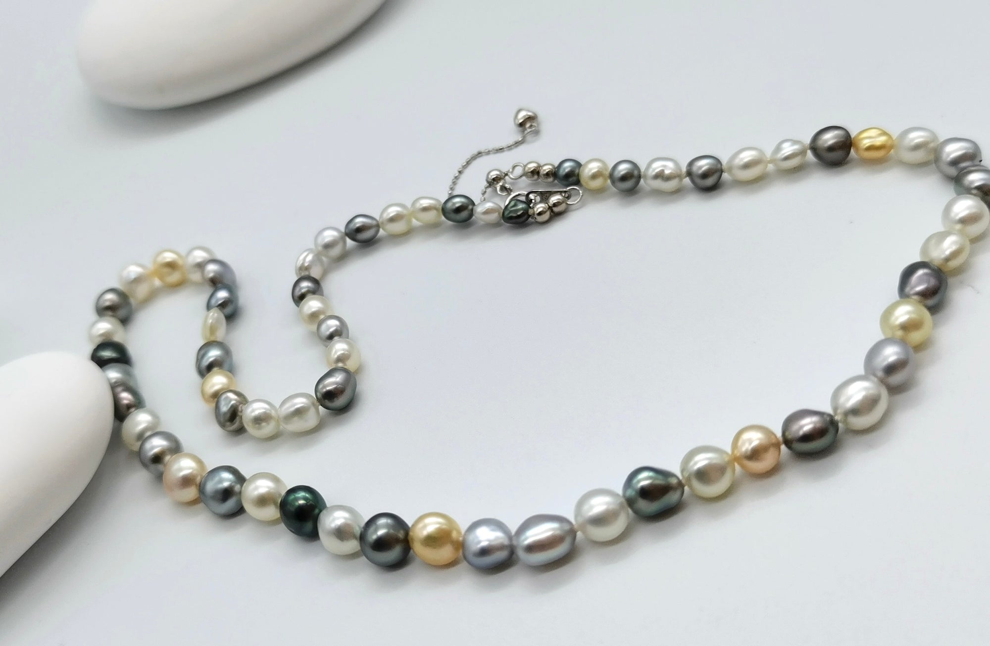Tri-colour keshi pearl strand with 4cm extension chain showing adjustable length and sterling silver clasp detail