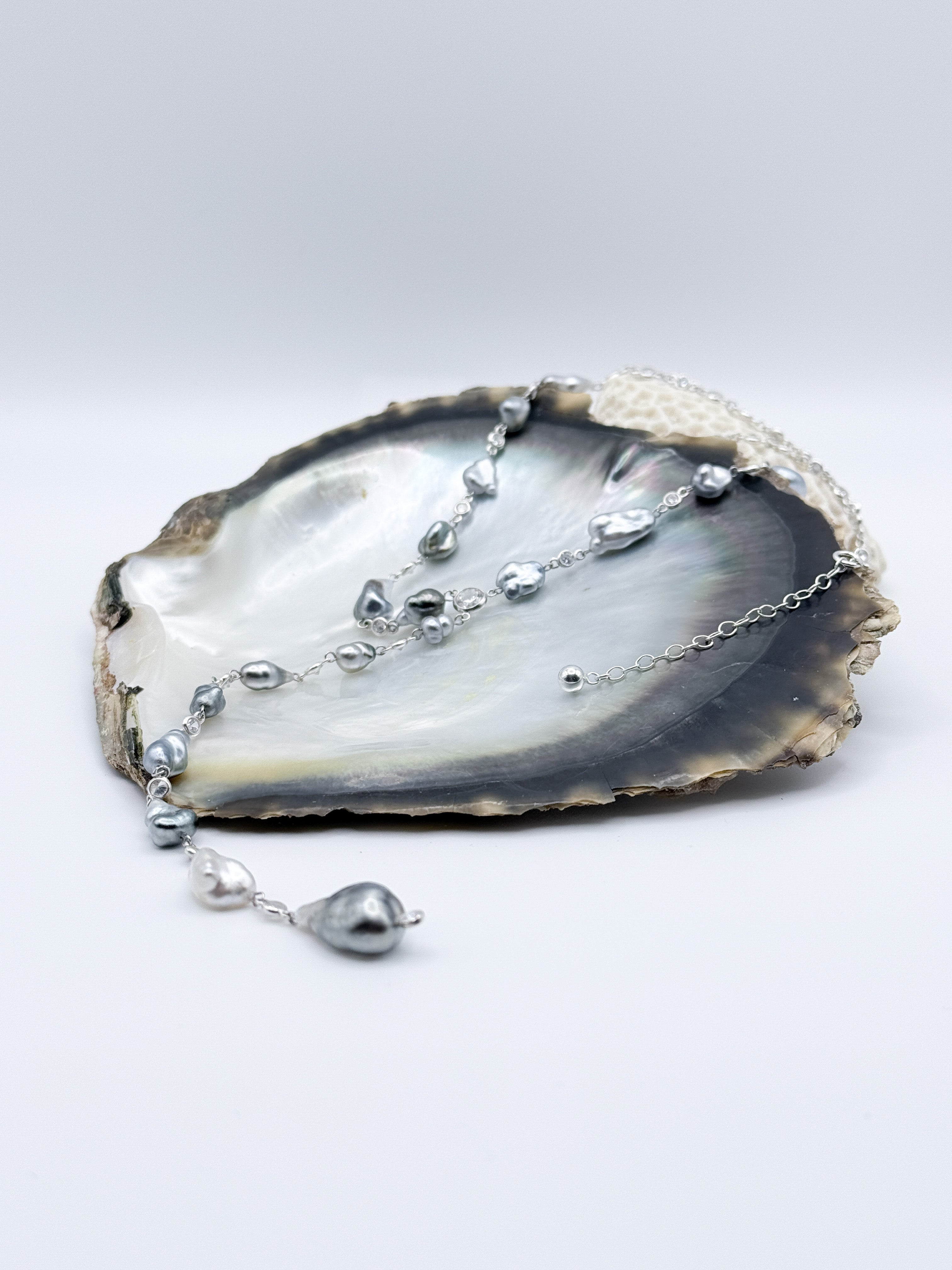 Zoomed-in image of smaller Tahitian Keshi pearls showing silvery tones and natural iridescence