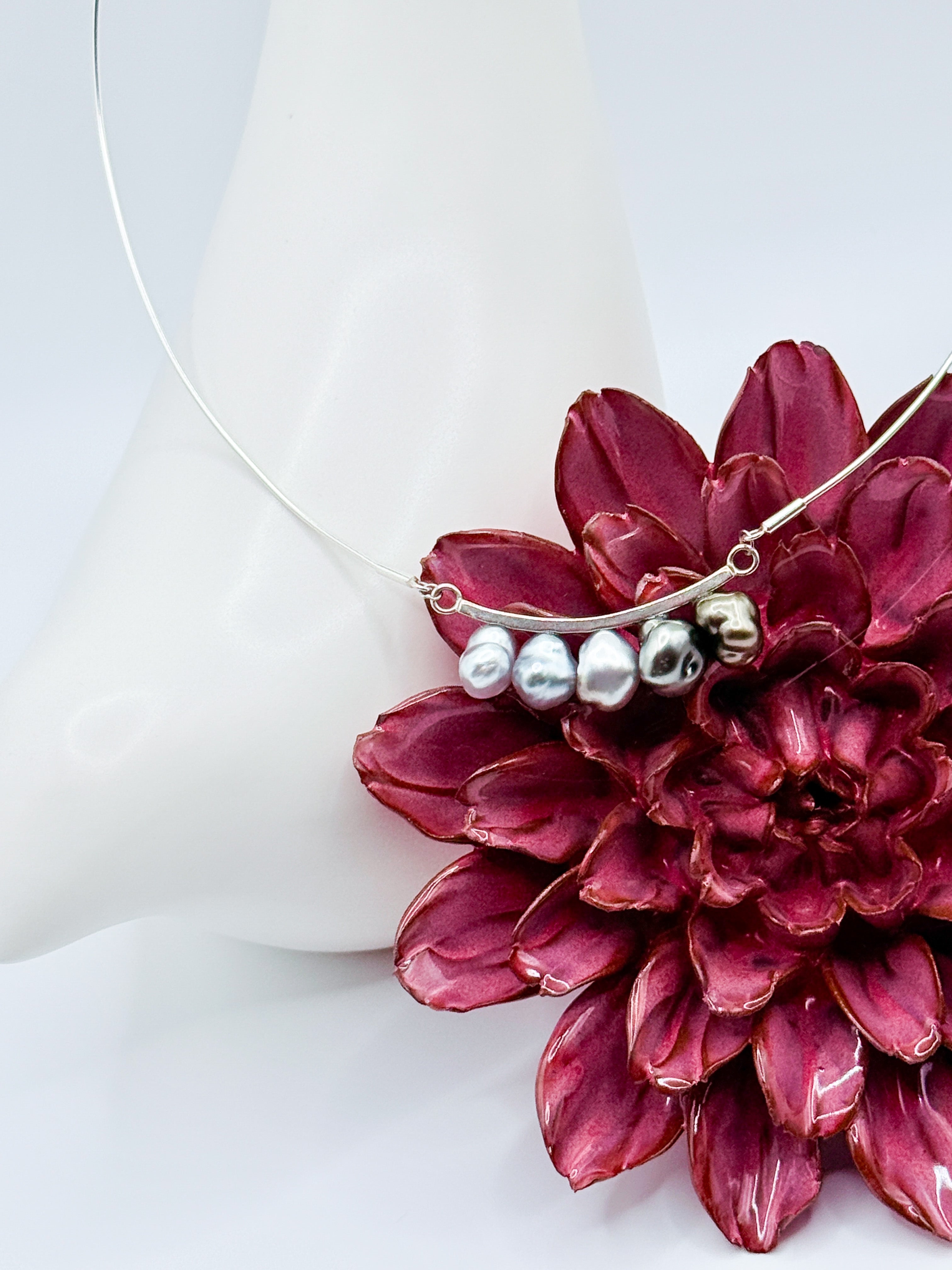 Close up image of the pearls on the 5 pearl bar pendant necklace