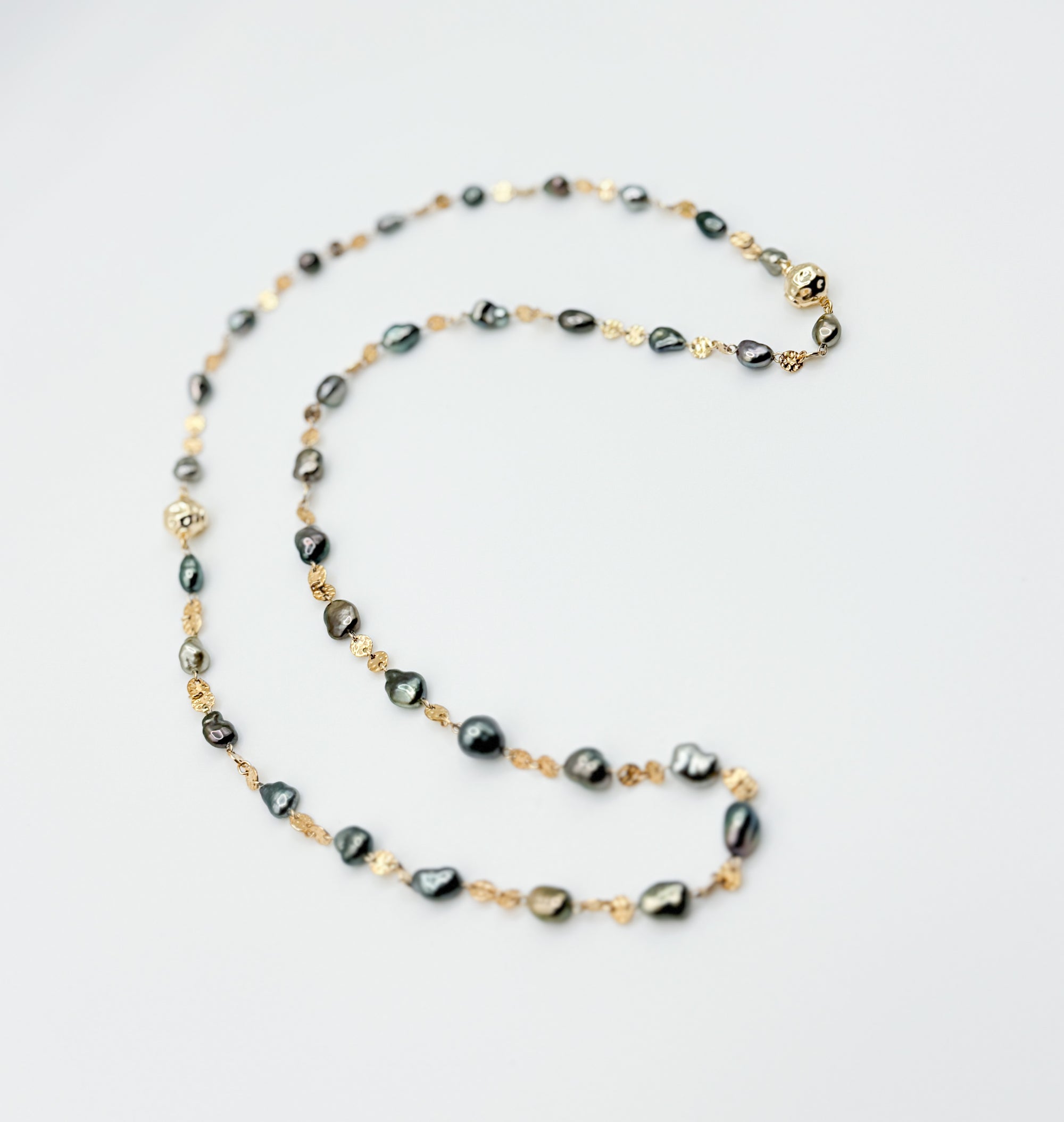 Necklace extended in spiral layout showing clasp and alternating pearl and link rhythm