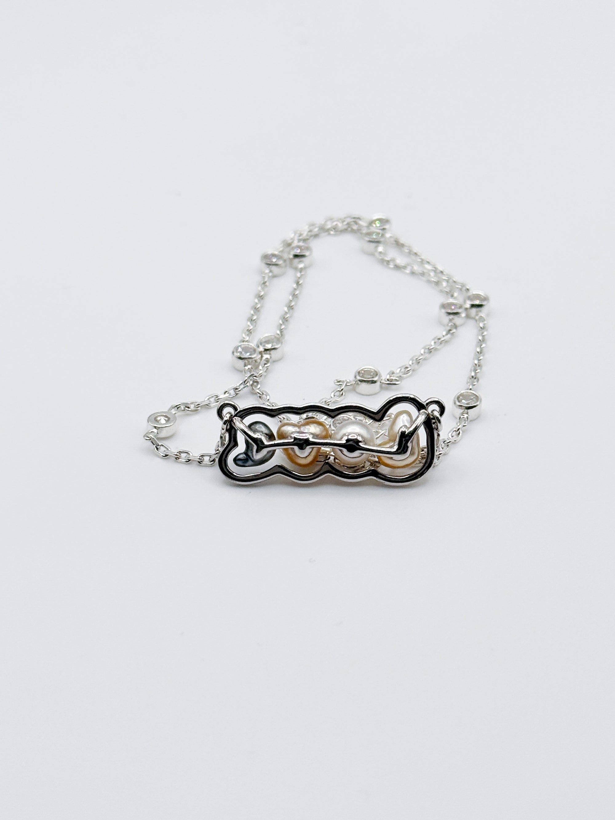 Details of mounting of the love letter pendant from back lay flat on white background