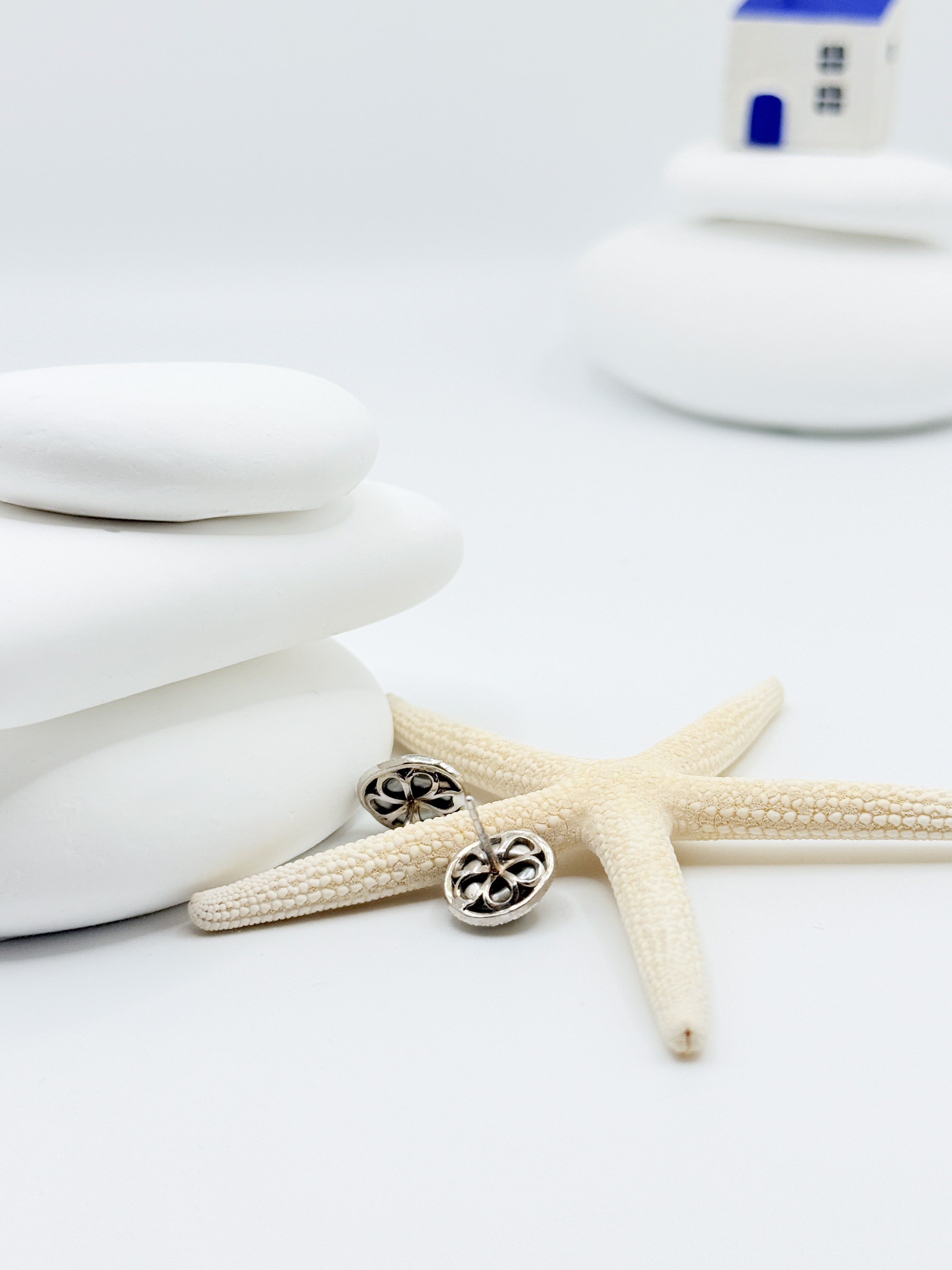 Tahitian Keshi pearl stud earrings showing decorative openwork gallery backs rhodium plated 925 sterling silver