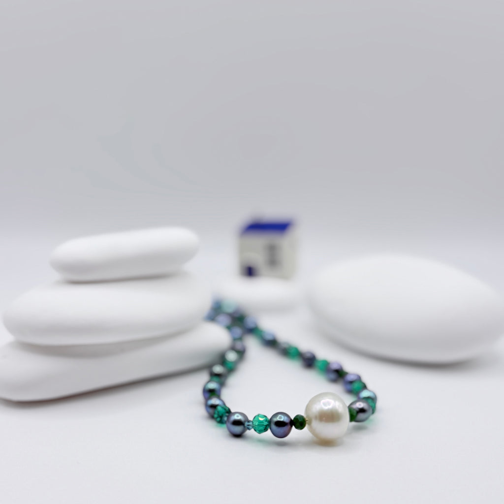 White South Sea pearl necklace with blue freshwater pearls and green crystal beads, 40cm length with off-centre baroque pearl arrangement