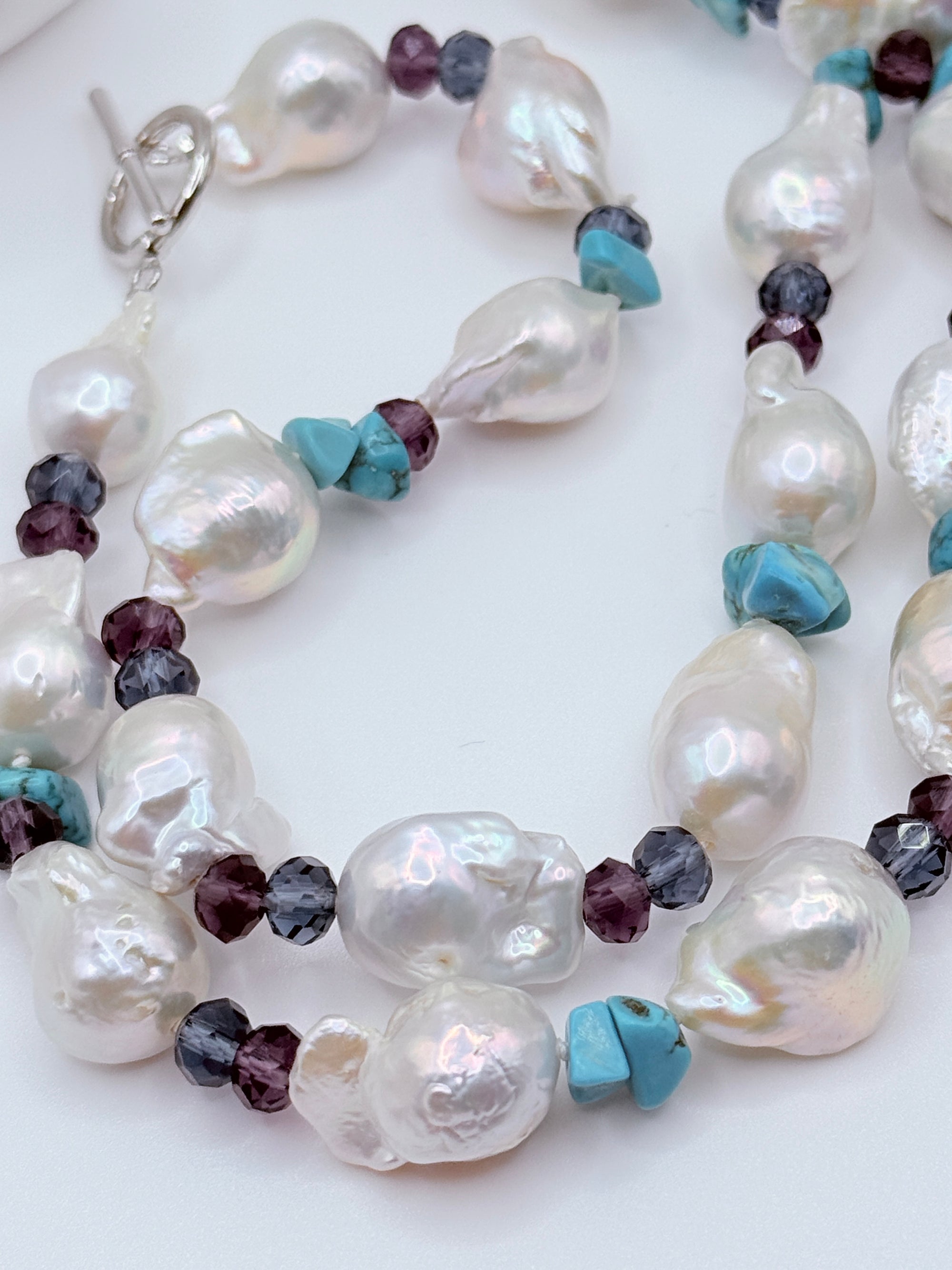 close up view of complete baroque pearl jewellery set showing organic pearl shapes and bead arrangement
