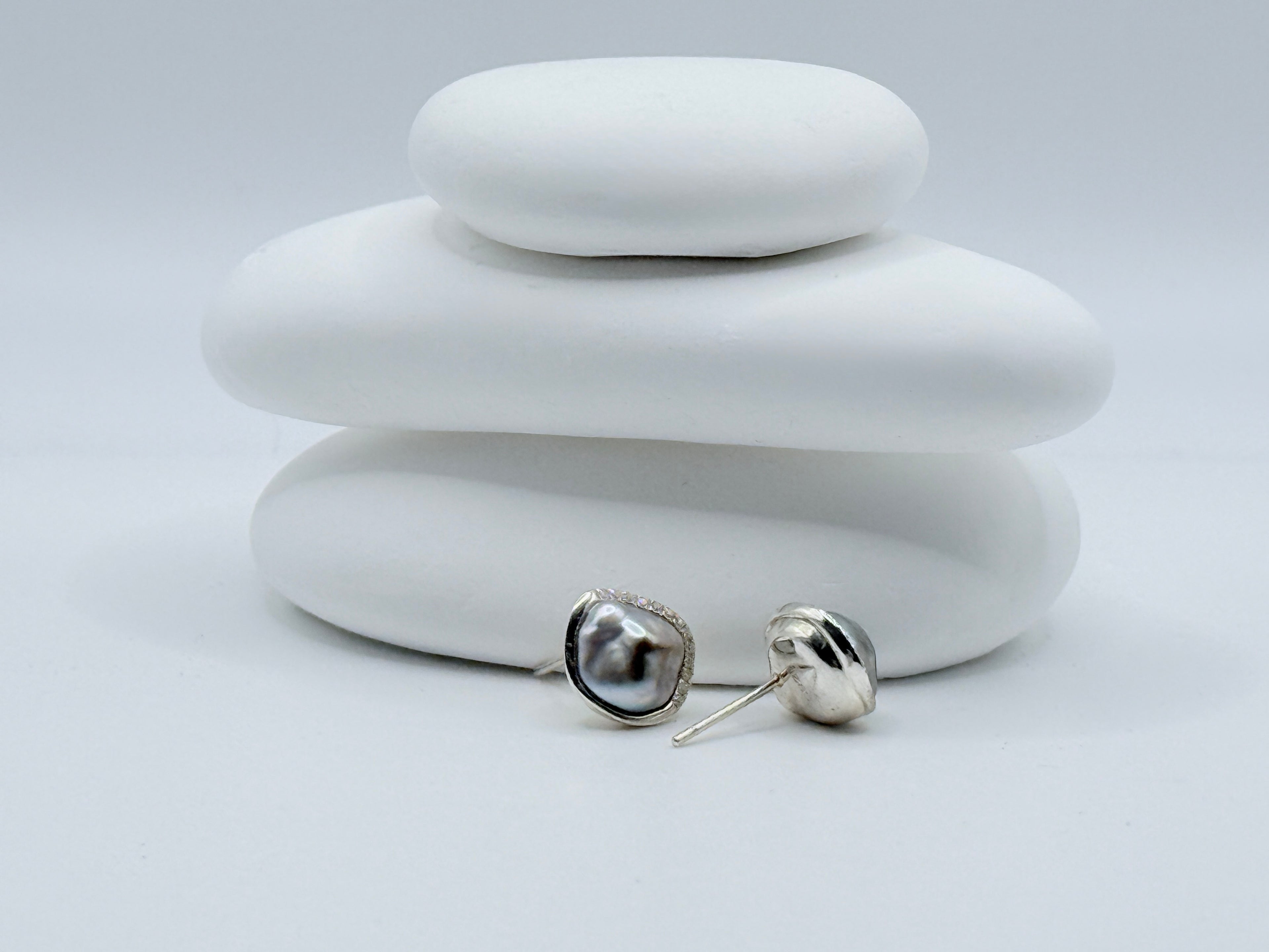 Tahitian Keshi pearl stud earrings showing solid close-back setting of 925 sterling silver