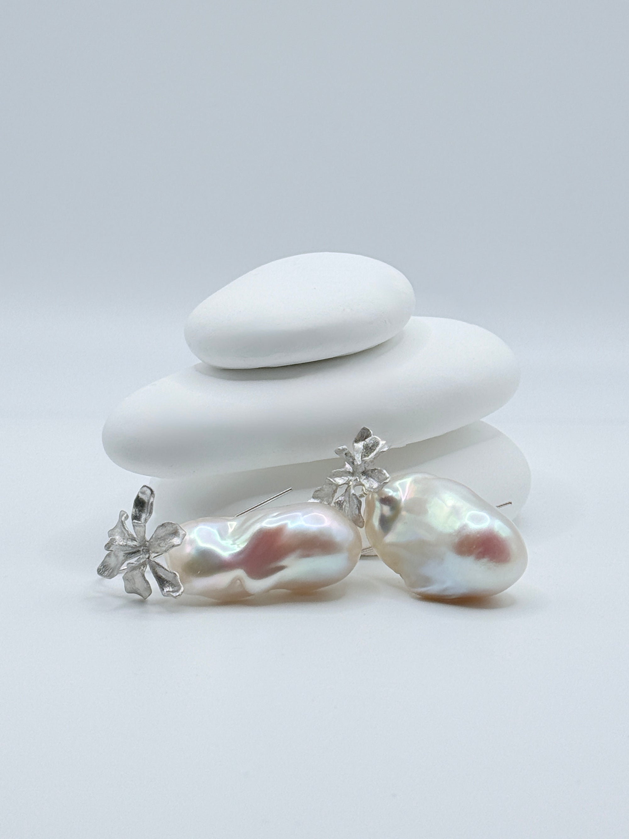 Sterling silver convertible earrings with 20x34mm baroque freshwater pearls displaying iridescent lustre and floral details on white stones