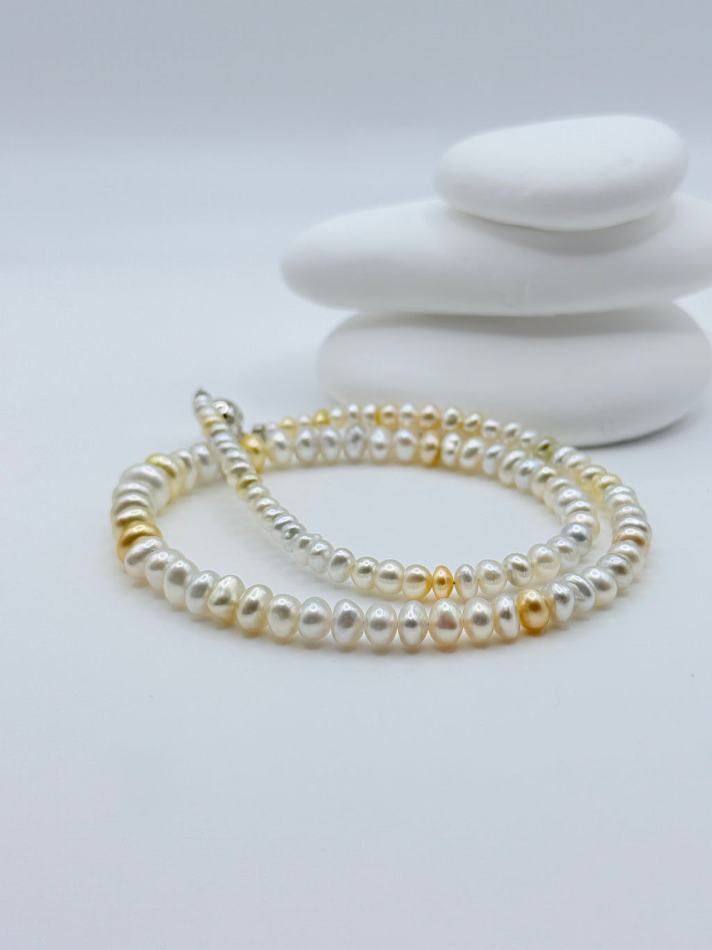 South Sea gold and white keshi roundel rivière strand with sterling silver ball and bar clasp showing graduated 3-8mm sizes