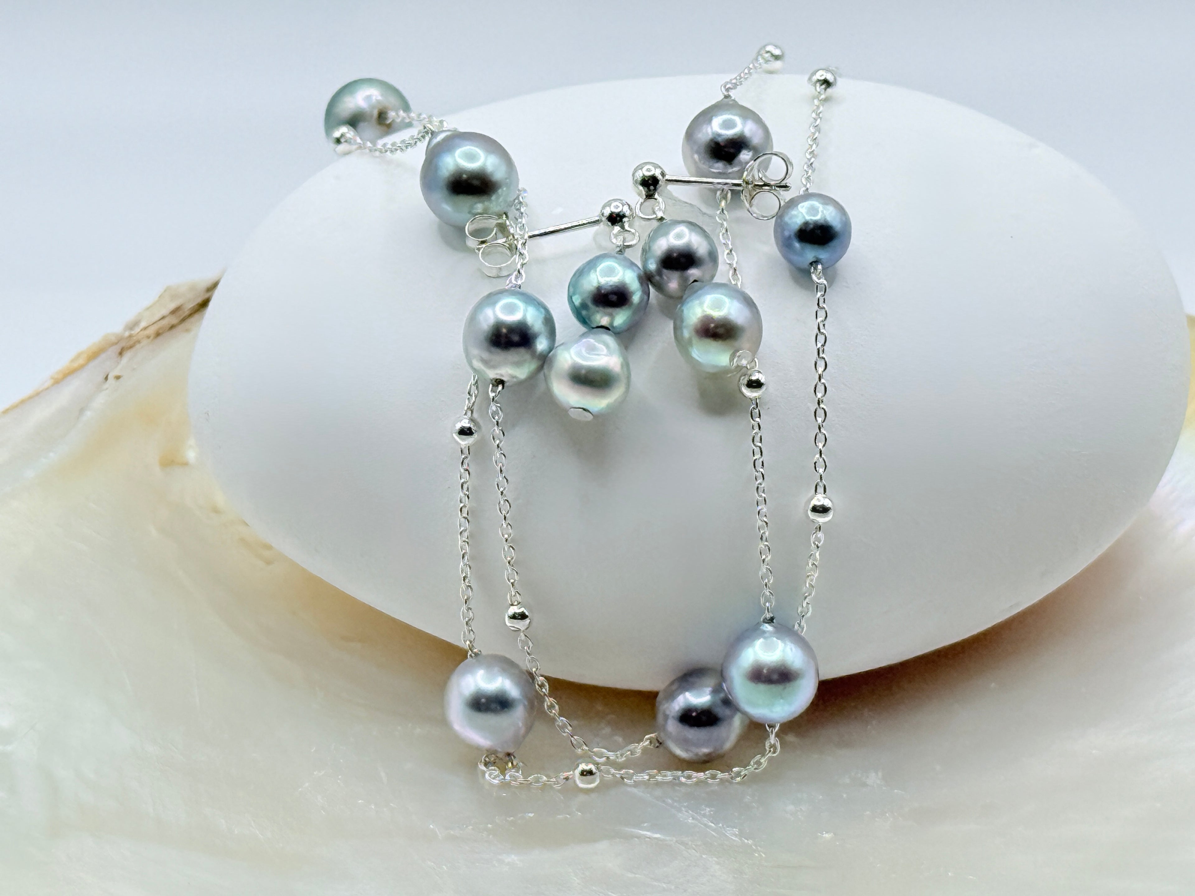 Blue baroque Akoya pearl drop earrings and station necklace set showing 9 pearls on 45cm chain with white shell styling