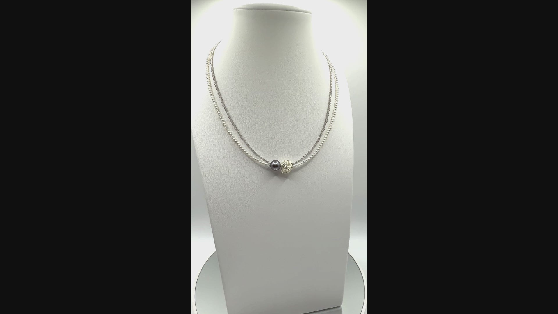 Video showing Tahitian pearl choker with tourmaline and seed pearls rotating to display all angles of the green baroque pearl and colourful gemstone beads