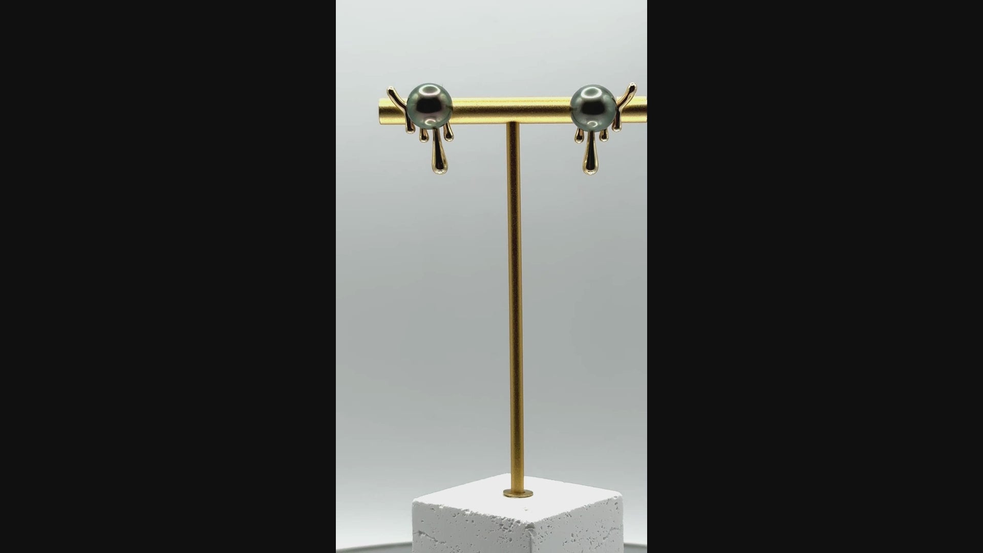 Video of Tahitian pearl stud earrings with molten 925 silver design, showing lustre and organic earring form.