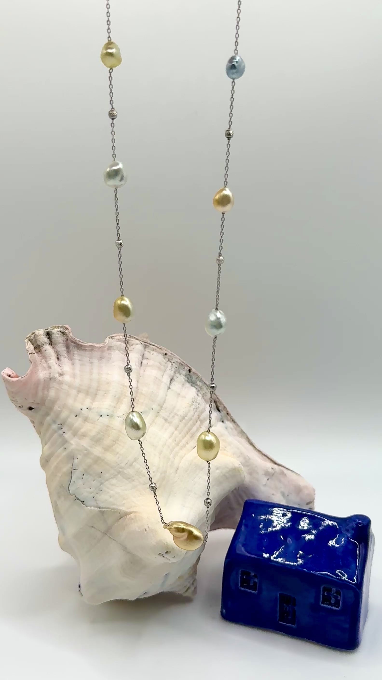 Video of south sea keshi necklace suspended in the air showing natural movement