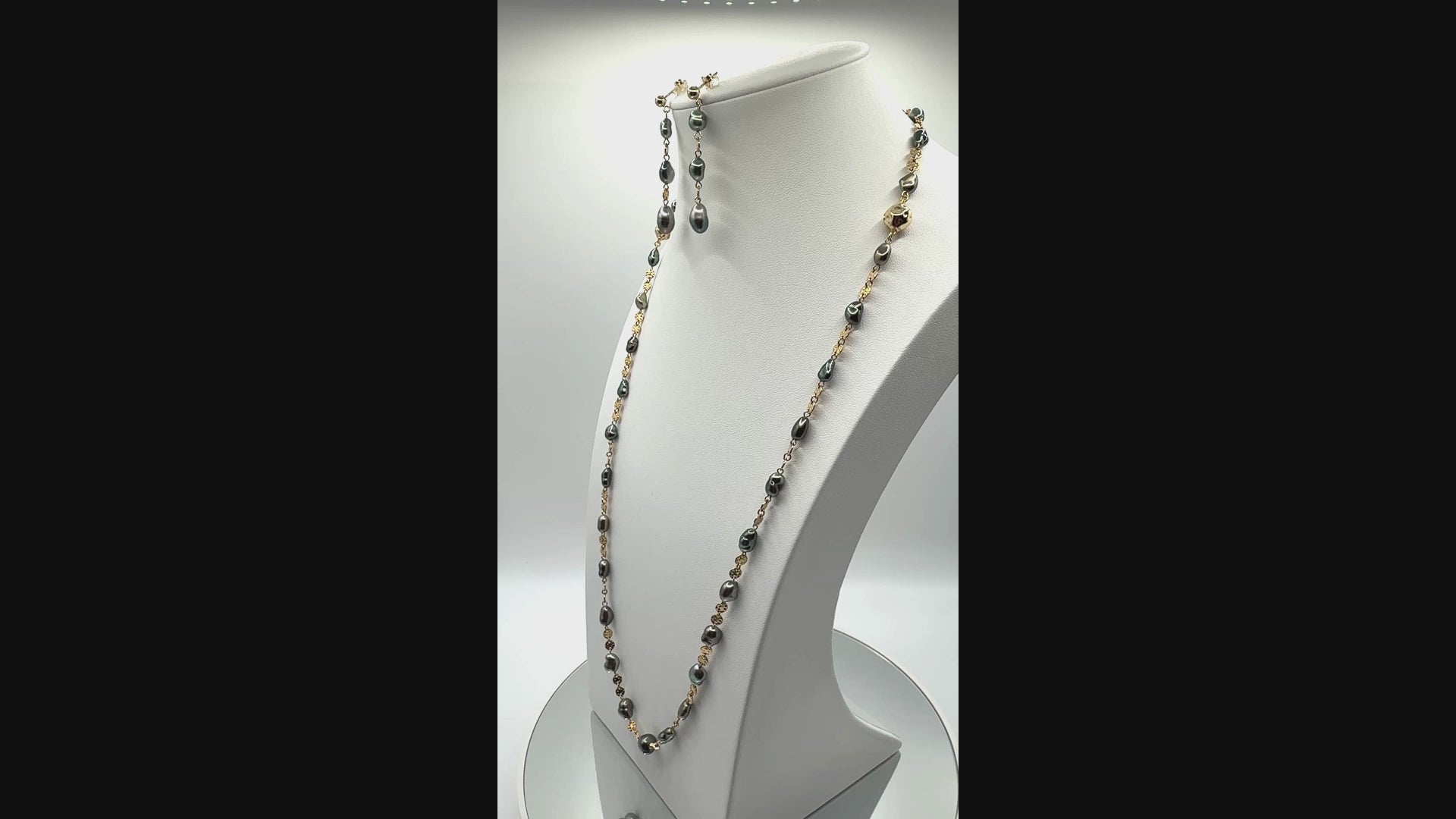 Rotating video of Tahitian Keshi pearl parure set highlighting lustre of pearls, gold-filled detailing, and cohesive design of necklace, earrings, and bracelet
