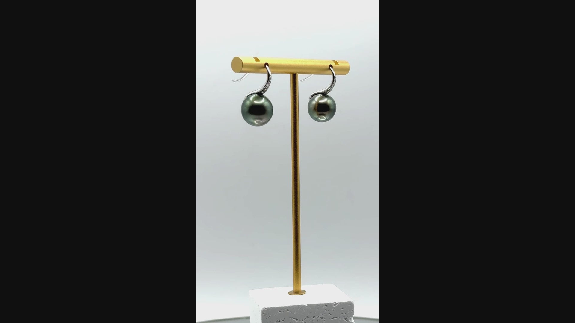 Video of Tahitian pearl drop earrings with sterling silver hooks, showing 11.5–11.9mm round pearls in motion and light.