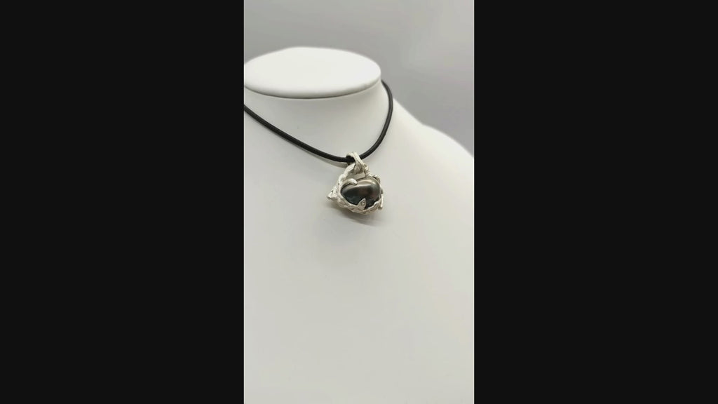 Video of Tahitian pearl heart pendant on a white bust rotating showing the style of the item being worn.