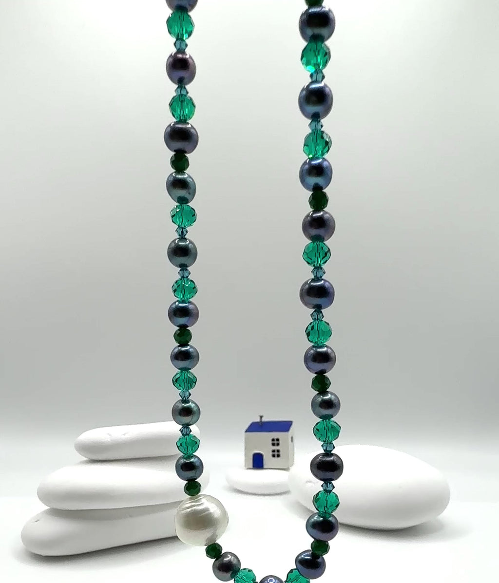 Video showing necklace movement displaying lustre of white South Sea pearl with blue freshwater pearls and crystal accents