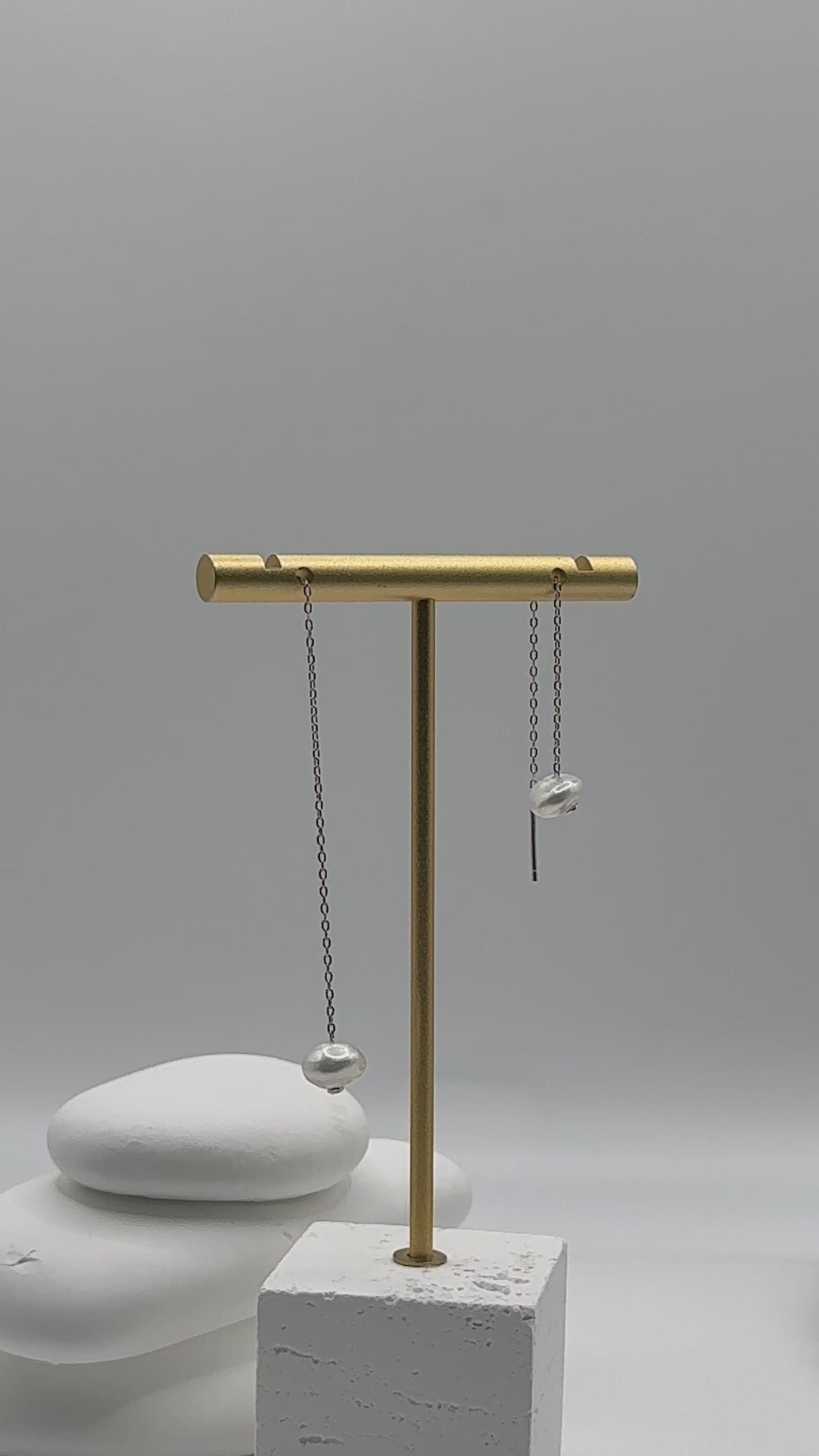 Video showing sterling silver threader earrings with white South Sea keshi pearls displaying graceful dangling movement and natural pearl lustre