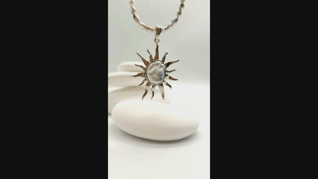 VIDEO OF CLOSE UP VIEW OF BAROQUE SUNBURST PENDANT ON NECKLACE
