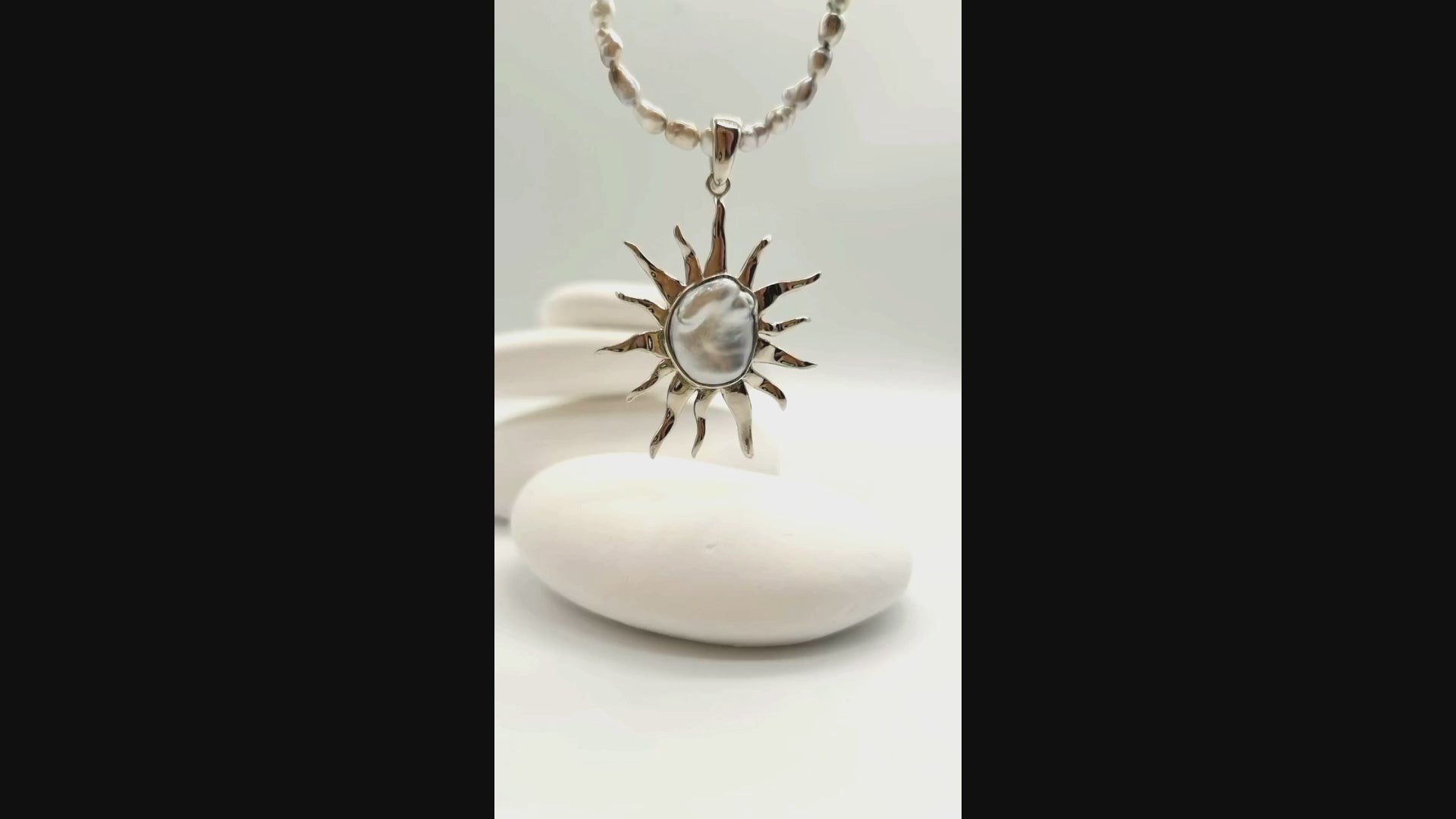 VIDEO OF CLOSE UP VIEW OF BAROQUE SUNBURST PENDANT ON NECKLACE