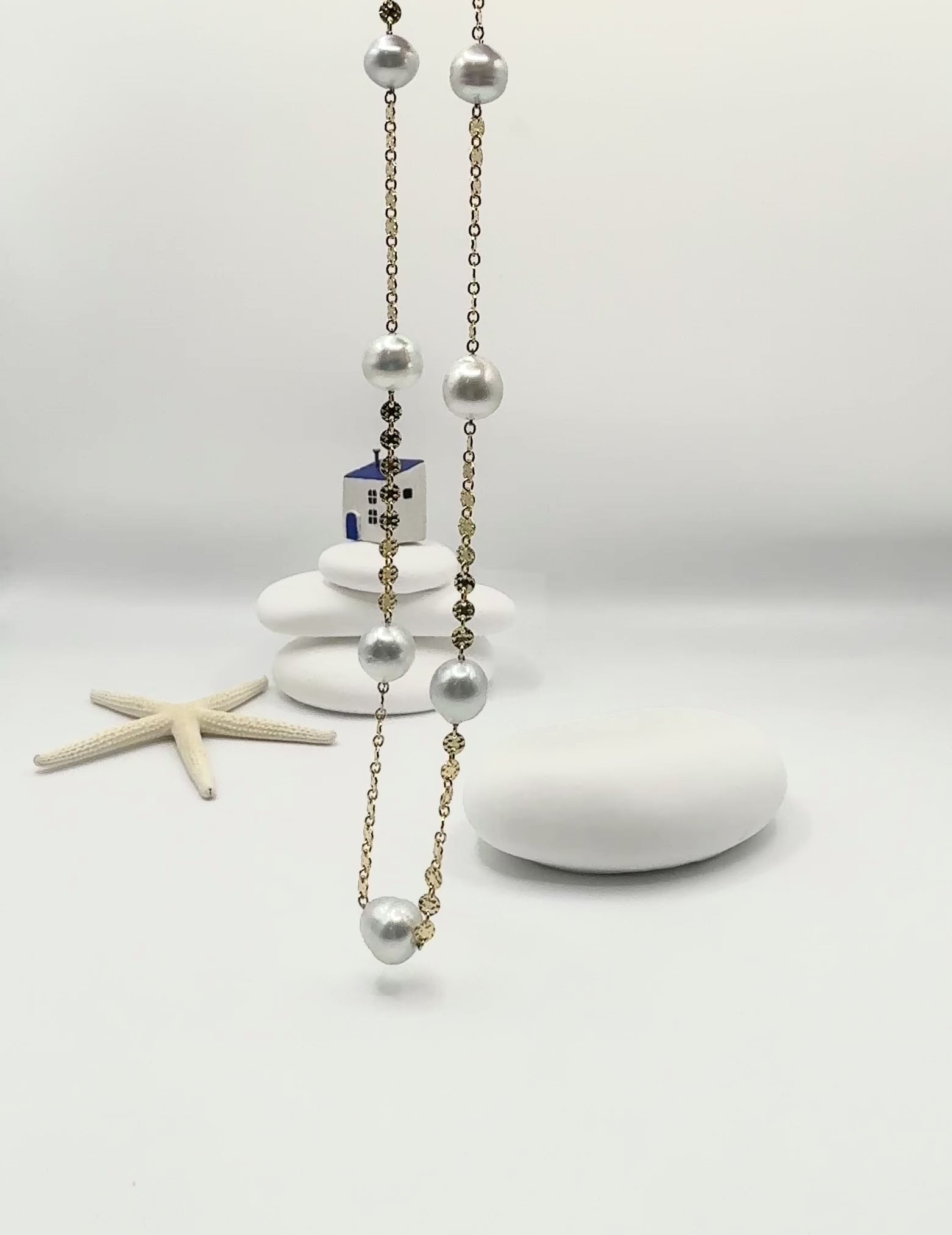 Aurora Mare white South Sea circled pearl station necklace 14K gold filled chain 45cm suspended showing natural movement and pearl lustre