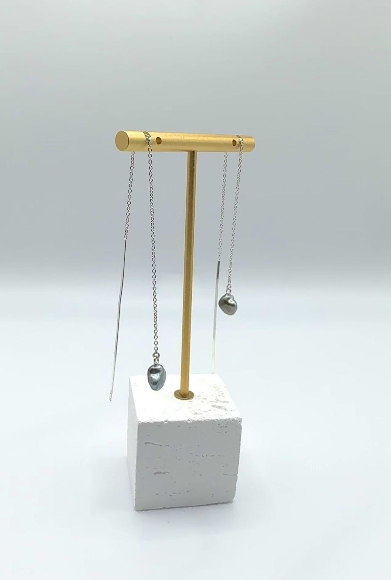 Tahitian Keshi pearl threader earrings showing gentle movement 7mm baroque pearls sterling silver chains fluid motion